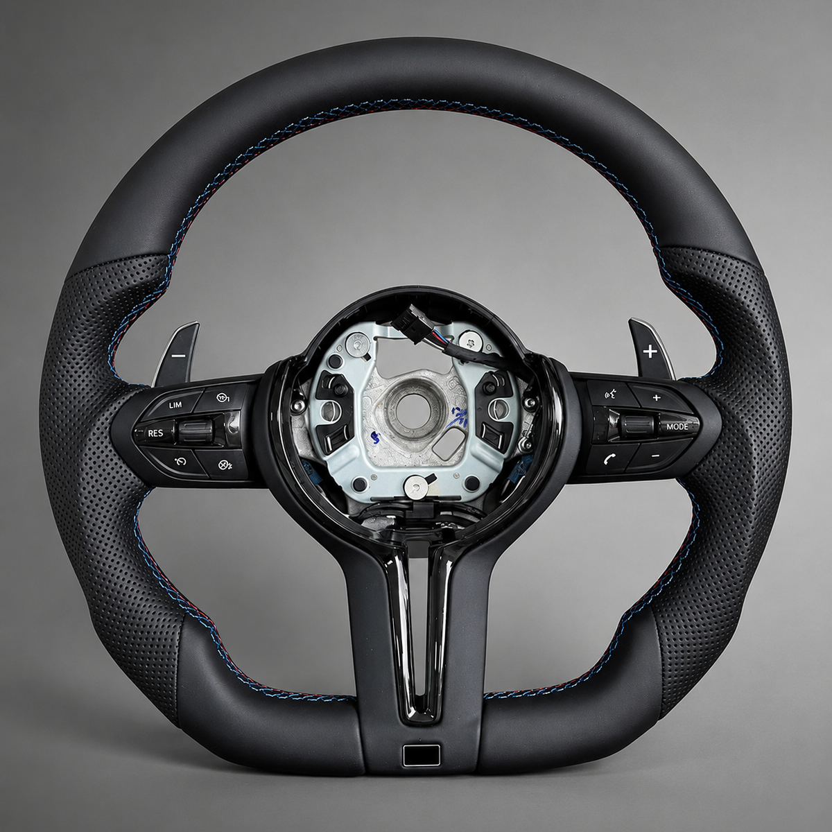 BMW F Series flat bottom steering wheel in black leather with M Sport tri-colour stitching, front view